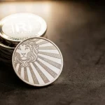 a stack of coins sitting on top of a table