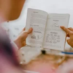 person reading book during daytime