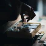 a close up of a person playing a board game